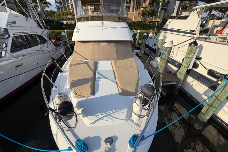 Slide: The Image of 2000 Carver 356 Aft Cabin Motor Yacht docked at marina, aerial view. - 3
