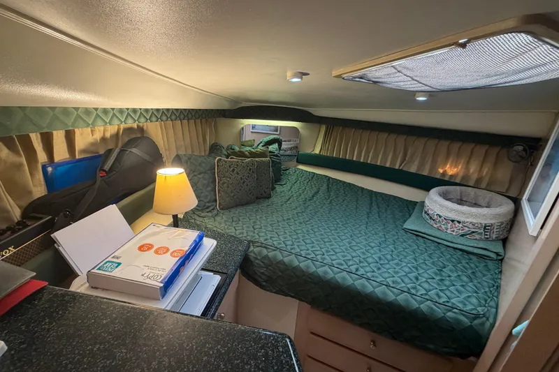 Slide: The Image of Cozy cabin interior of 2000 Carver 356 Aft Cabin Motor Yacht with green bedding. - 30