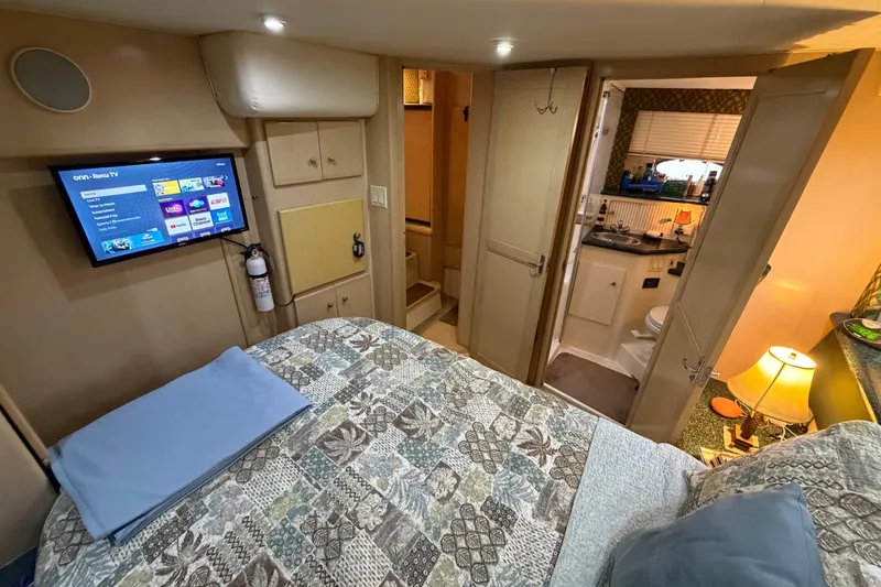 Slide: The Image of Interior of 2000 Carver 356 Aft Cabin Motor Yacht with cozy bedroom and ensuite bathroom. - 34