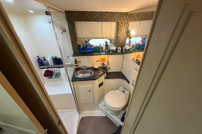 Slide: The Image of Bathroom interior of 2000 Carver 356 Aft Cabin Motor Yacht, featuring shower and sink. - 35