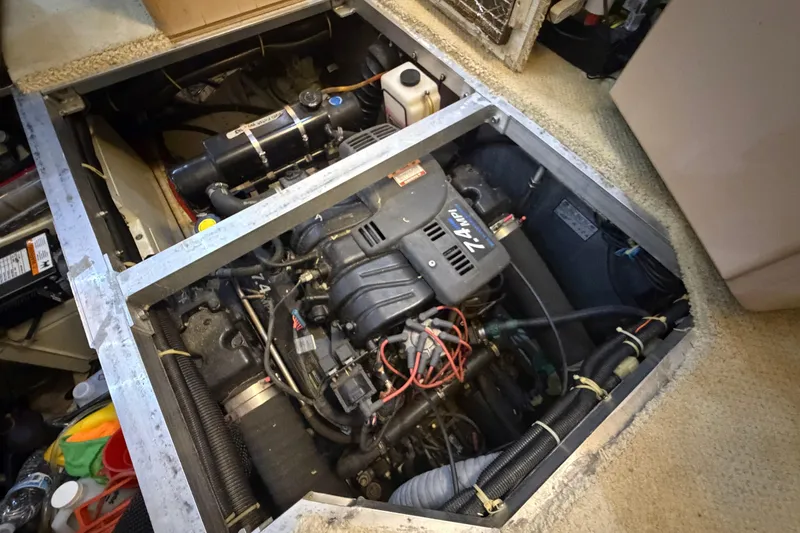 Slide: The Image of Engine compartment of 2000 Carver 356 Aft Cabin Motor Yacht, showcasing mechanical components. - 38