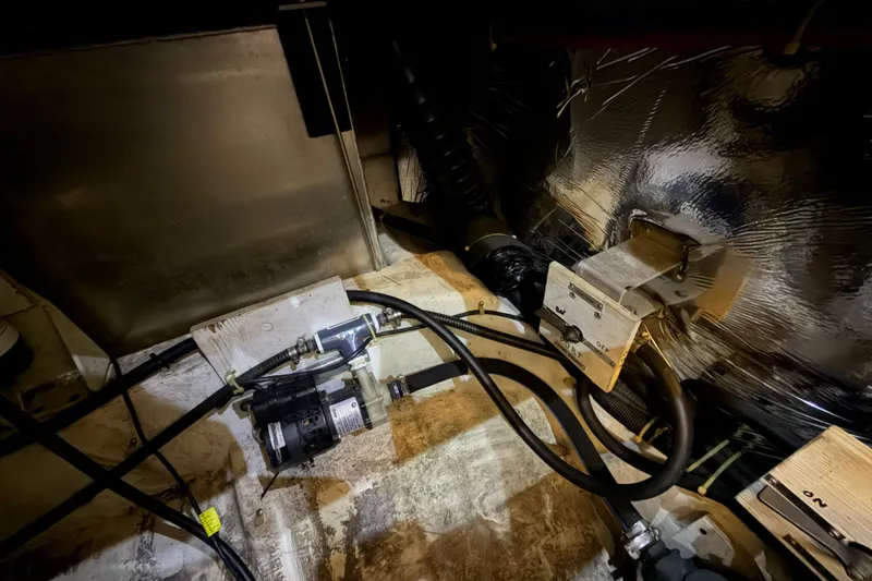 Slide: The Image of Engine room of 2000 Carver 356 Aft Cabin Motor Yacht with visible wiring and components. - 46