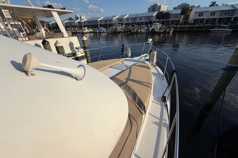 Slide: The Image of 2000 Carver 356 Aft Cabin Motor Yacht docked at marina, sunny day. - 6