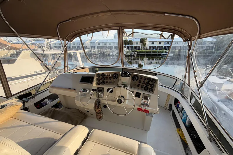 Slide: The Image of Interior view of 2000 Carver 356 Aft Cabin Motor Yacht helm station. - 9