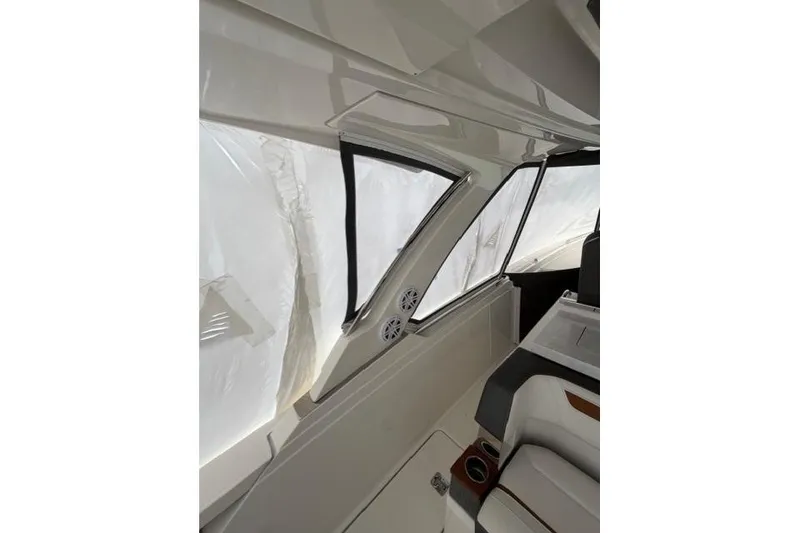 Slide: The Image of Interior view of 2021 Tiara Sport 38 LS boat, featuring sleek design and seating. - 10