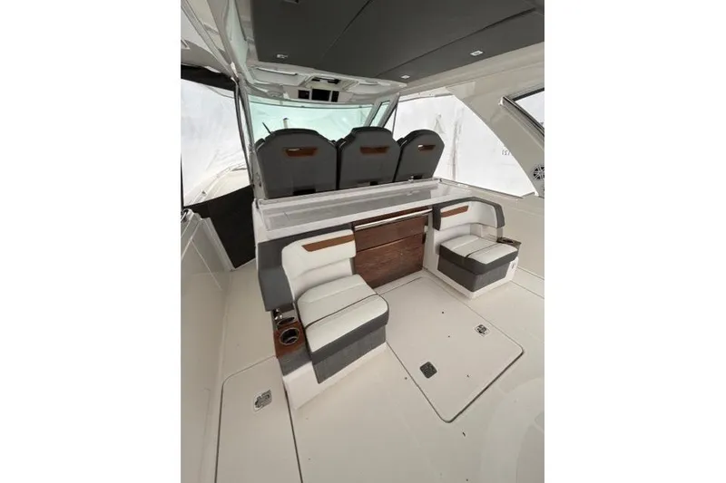 Slide: The Image of 2021 Tiara Sport 38 LS interior with luxurious seating and modern design. - 11