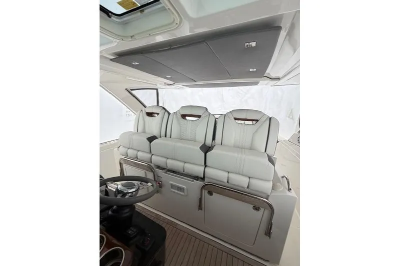 Slide: The Image of 2021 Tiara Sport 38 LS boat interior with luxurious seating and modern design. - 18