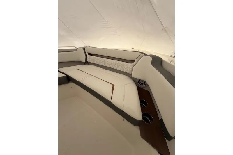 Slide: The Image of 2021 Tiara Sport 38 LS boat interior with luxurious seating and cup holders. - 22