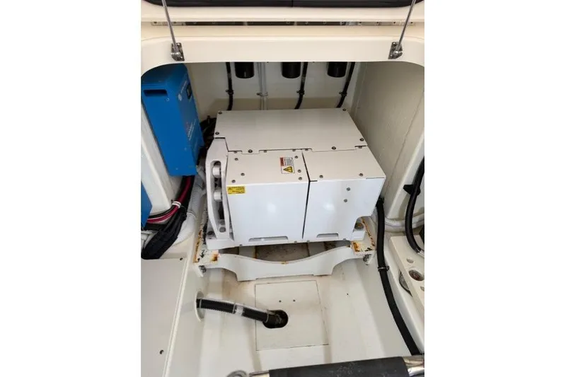 Slide: The Image of 2021 Tiara Sport 38 LS engine compartment with electrical components and wiring. - 31