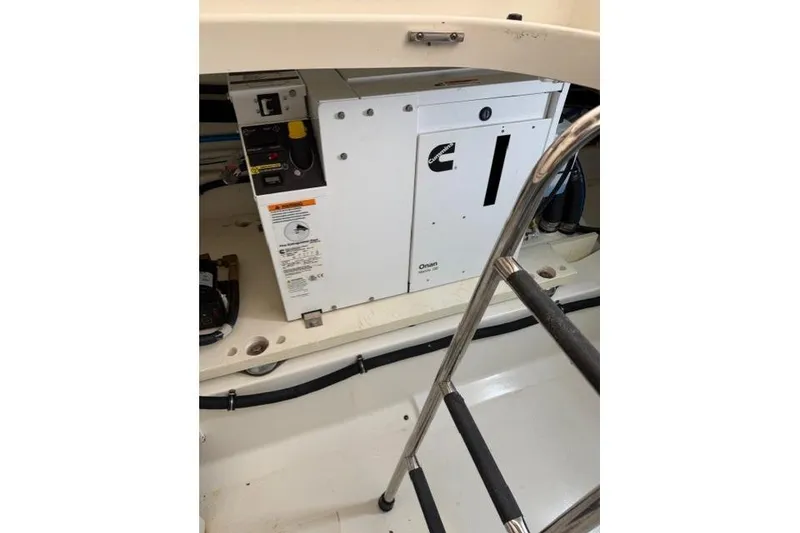 Slide: The Image of 2021 Tiara Sport 38 LS boat engine compartment with Cummins generator. - 32