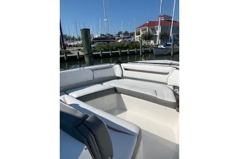 Slide: The Image of 2021 Tiara Sport 38 LS boat with spacious seating at a marina. - 5