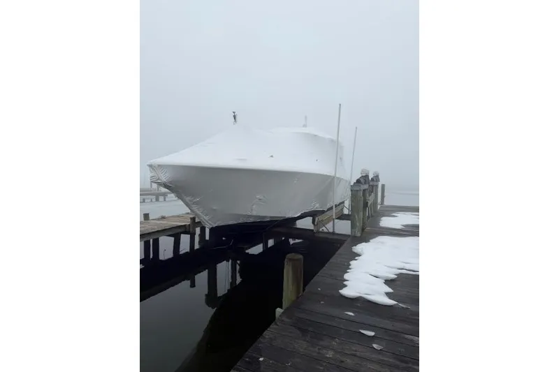 Slide: The Image of 2021 Tiara Sport 38 LS boat covered in snow on a dock. - 7