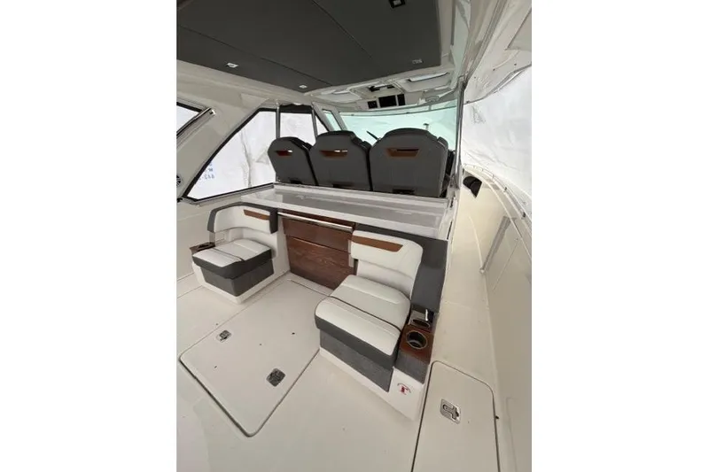 Slide: The Image of 2021 Tiara Sport 38 LS interior with modern seating and sleek design. - 9