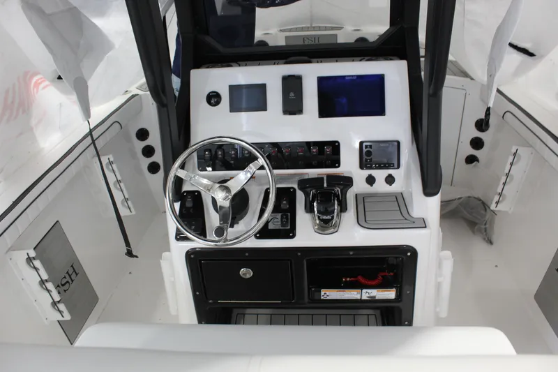 Slide: The Image of 2025 Yamaha Boats 222 FSH Sport E dashboard with steering wheel and control panel. - 4