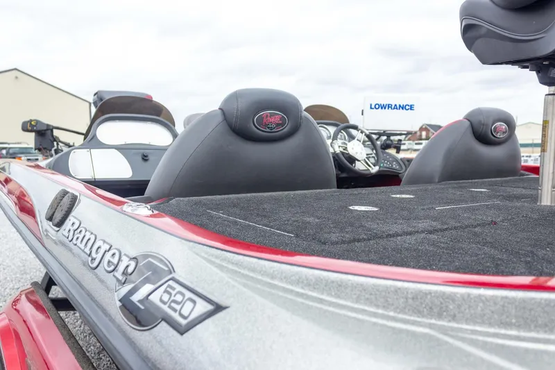 Slide: The Image of 2009 Ranger Z520 Comanche boat interior with steering wheel and seats, featuring Lowrance equipment. - 14