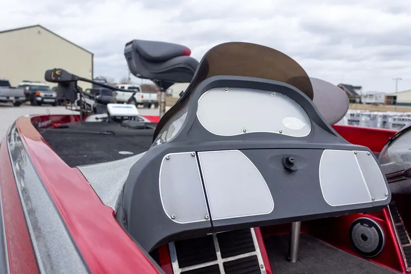 Slide: The Image of 2009 Ranger Z520 Comanche boat dashboard with steering wheel and seat, outdoors. - 15