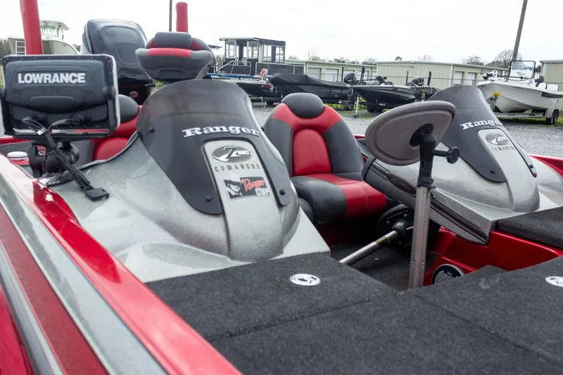 Slide: The Image of 2009 Ranger Z520 Comanche boat with red and gray seats, Lowrance electronics, and fishing equipment. - 19