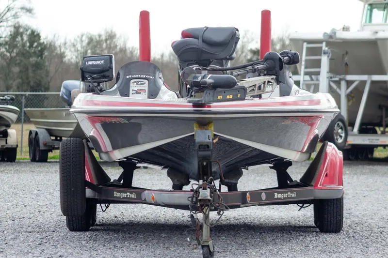 Slide: The Image of 2009 Ranger Z520 Comanche bass boat on trailer, front view, parked outdoors. - 2