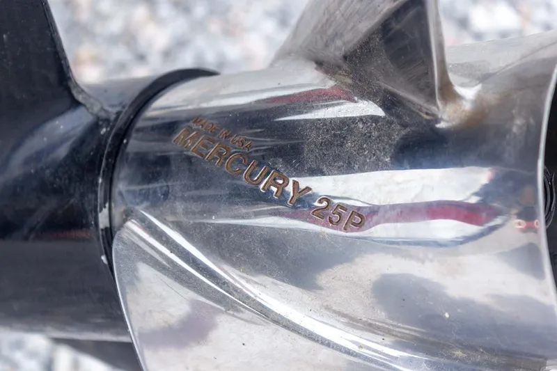 Slide: The Image of Close-up of a Mercury 25P propeller on a 2009 Ranger Z520 Comanche boat. - 25