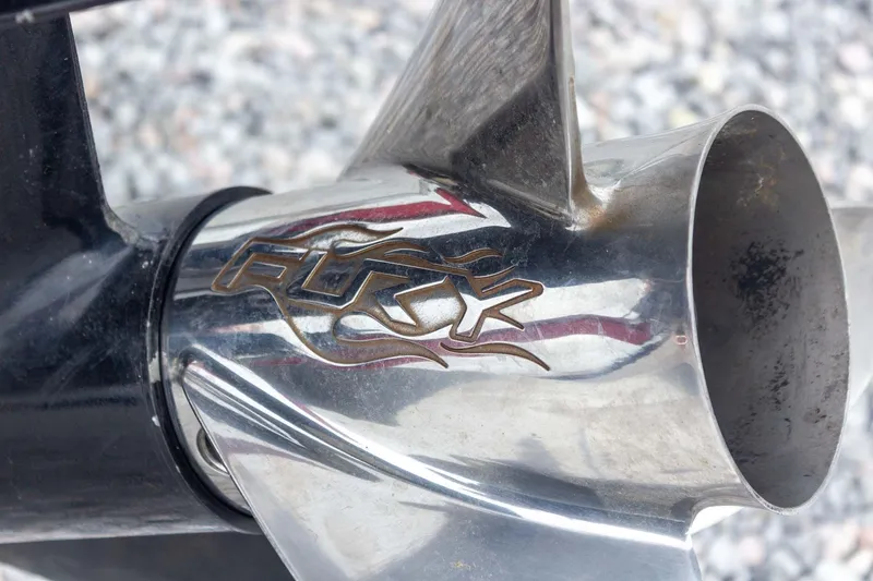 Slide: The Image of Close-up of a 2009 Ranger Z520 Comanche boat propeller with "Fury" logo. - 26