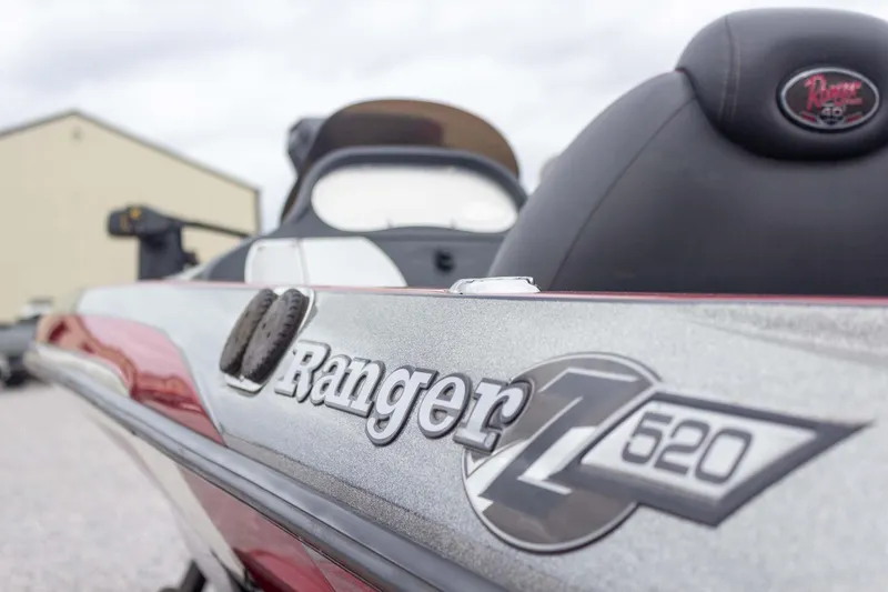 Slide: The Image of 2009 Ranger Z520 Comanche boat, close-up of logo and seating, outdoors. - 27