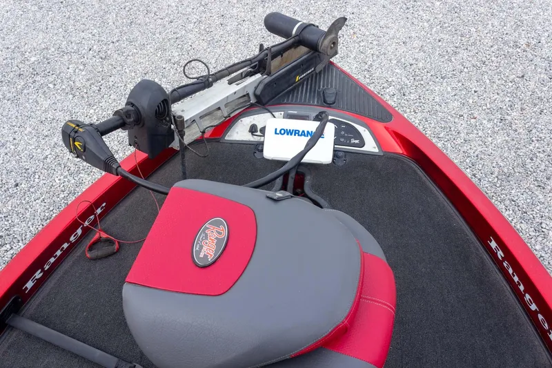 Slide: The Image of 2009 Ranger Z520 Comanche boat with Lowrance electronics and trolling motor on gravel surface. - 32