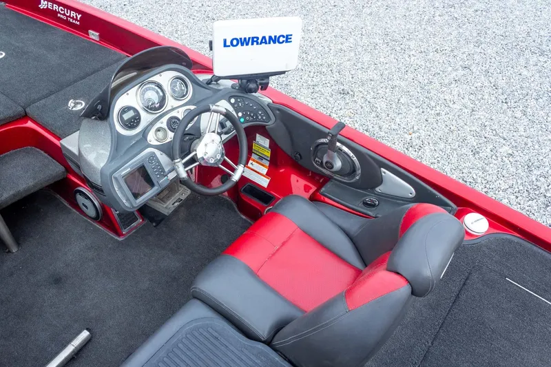 Slide: The Image of 2009 Ranger Z520 Comanche boat cockpit with steering wheel and Lowrance electronics. - 36