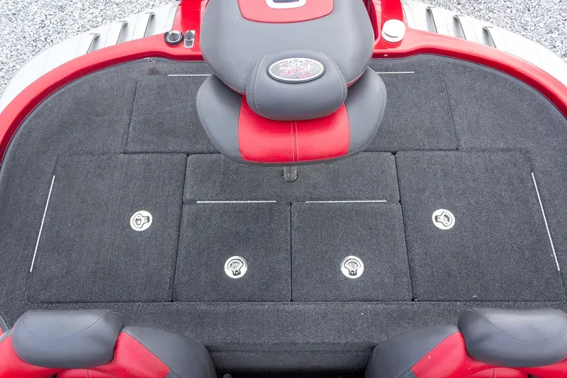 Slide: The Image of 2009 Ranger Z520 Comanche boat deck with red and black seating and storage compartments. - 42