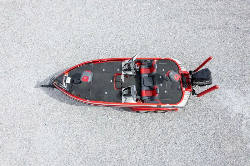 Slide: The Image of 2009 Ranger Z520 Comanche boat, aerial view, red and black design, parked on gravel. - 49