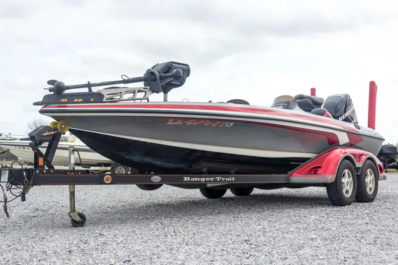Slide: The Image of 2009 Ranger Z520 Comanche boat on trailer, parked on gravel. - 5
