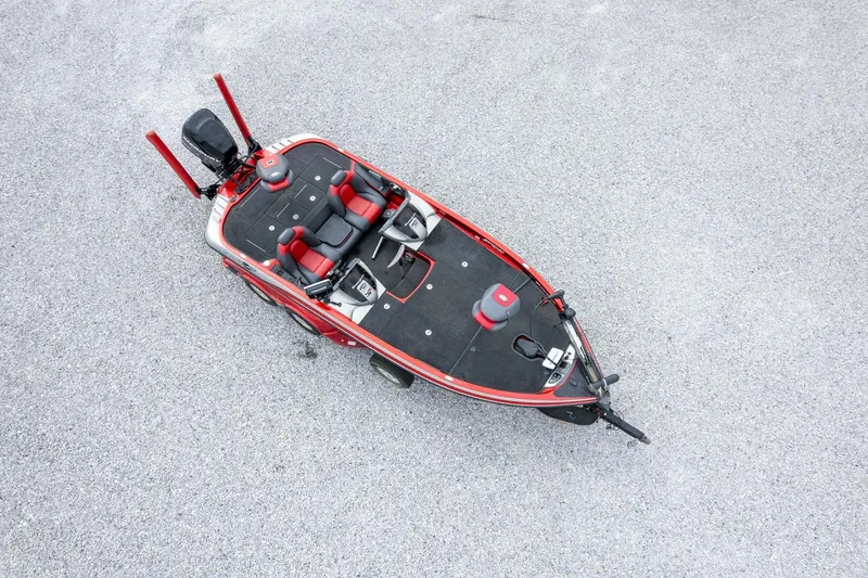 Slide: The Image of 2009 Ranger Z520 Comanche boat, aerial view, red and black design on gravel surface. - 54