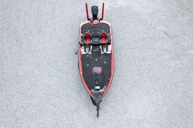 Slide: The Image of 2009 Ranger Z520 Comanche boat, aerial view, red and black design on gravel surface. - 55