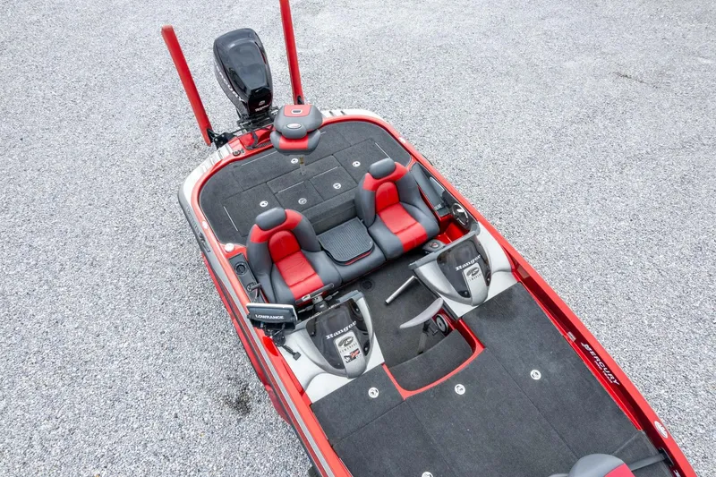 Slide: The Image of 2009 Ranger Z520 Comanche boat with red and black seating, viewed from above. - 56
