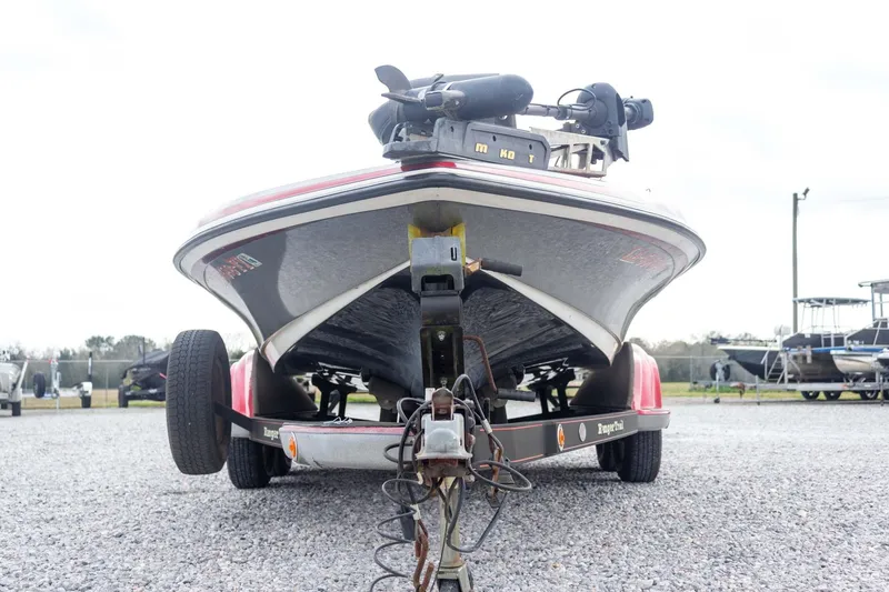 Slide: The Image of 2009 Ranger Z520 Comanche boat on trailer, parked on gravel lot. - 6