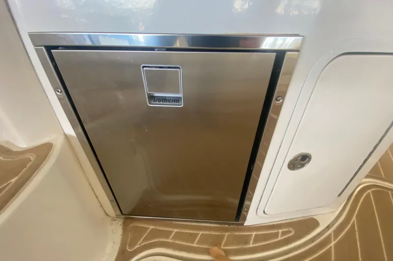 Slide: The Image of Stainless steel fridge on 2004 Sea Ray Sundancer 320 boat interior. - 17