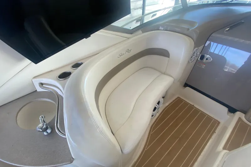 Slide: The Image of 2004 Sea Ray Sundancer 320 interior with seating and cup holders. - 19