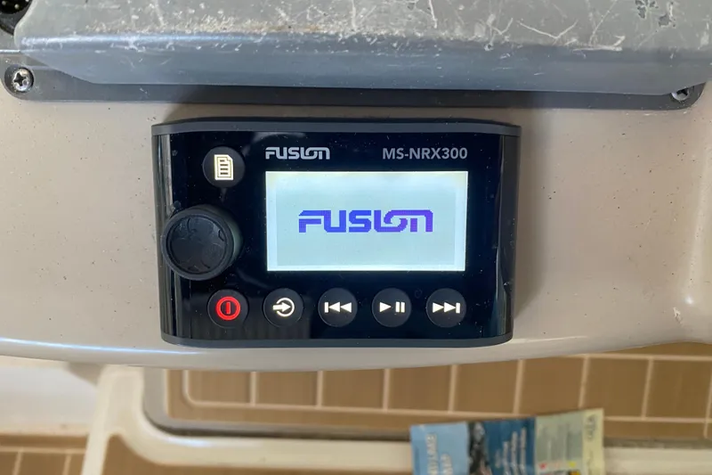 Slide: The Image of Fusion MS-NRX300 marine stereo on 2004 Sea Ray Sundancer 320 boat dashboard. - 21