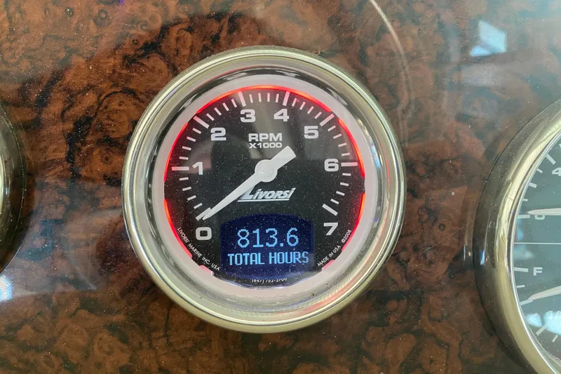 Slide: The Image of Tachometer of 2004 Sea Ray Sundancer 320 showing 813.6 total hours. - 24