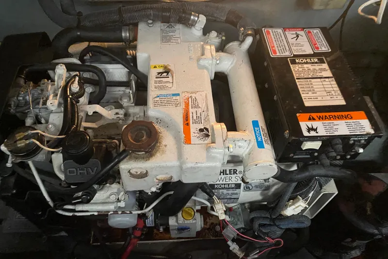 Slide: The Image of Engine compartment of a 2004 Sea Ray Sundancer 320 with Kohler power system. - 28