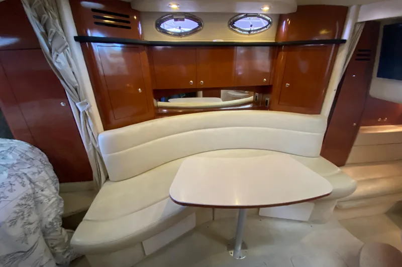 Slide: The Image of Interior of 2004 Sea Ray Sundancer 320 with elegant seating and wooden cabinetry. - 33