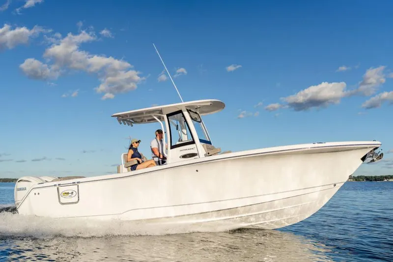 Slide: The Image of Manufacturer Provided Image: 2026 Sea Hunt Ultra 275 Coffin Box boat cruising on a sunny day. - 1