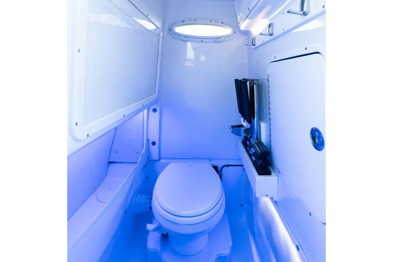 Slide: The Image of Manufacturer Provided Image: 2026 Sea Hunt Ultra 275 Coffin Box boat interior with modern marine toilet. - 9