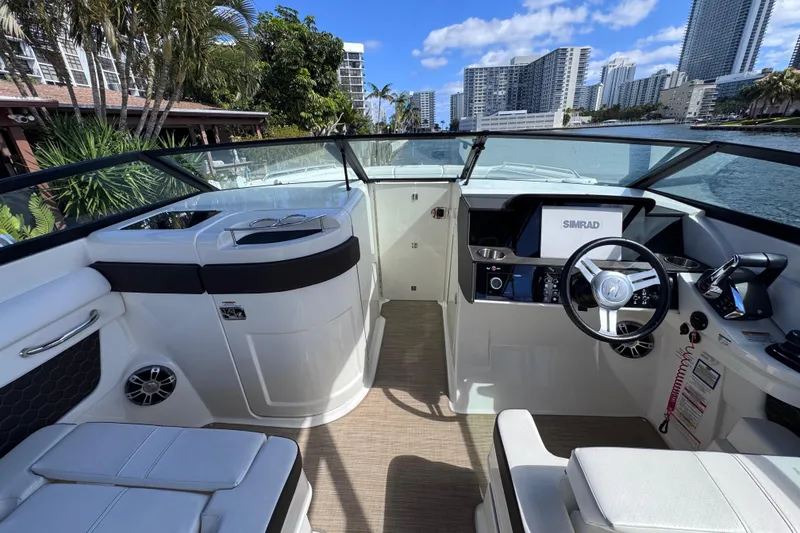 Slide: The Image of 2024 Sea Ray SDX 290 Outboard boat interior with modern helm and seating. - 14