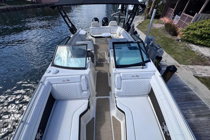 Slide: The Image of 2024 Sea Ray SDX 290 Outboard boat docked, featuring spacious seating and modern design. - 15