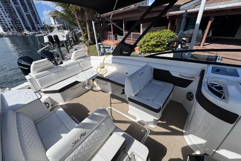 Slide: The Image of 2024 Sea Ray SDX 290 Outboard boat interior with luxurious seating and modern amenities. - 16