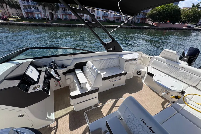 Slide: The Image of 2024 Sea Ray SDX 290 Outboard boat interior with seating and steering console. - 22