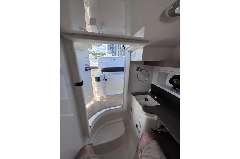 Slide: The Image of Interior view of 2024 Sea Ray SDX 290 Outboard, featuring a compact cabin space. - 24