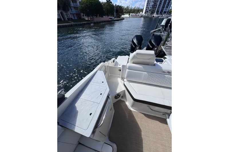 Slide: The Image of 2024 Sea Ray SDX 290 Outboard boat interior with waterfront view. - 28