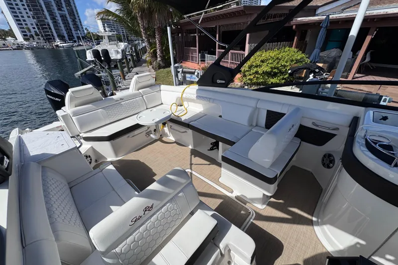 Slide: The Image of 2024 Sea Ray SDX 290 Outboard boat interior with luxurious seating and modern design. - 9
