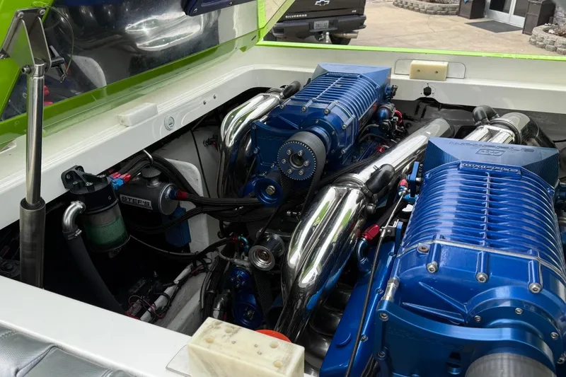 Slide: The Image of Engine compartment of a 2002 Fountain 42 Lightning boat with dual blue superchargers. - 14